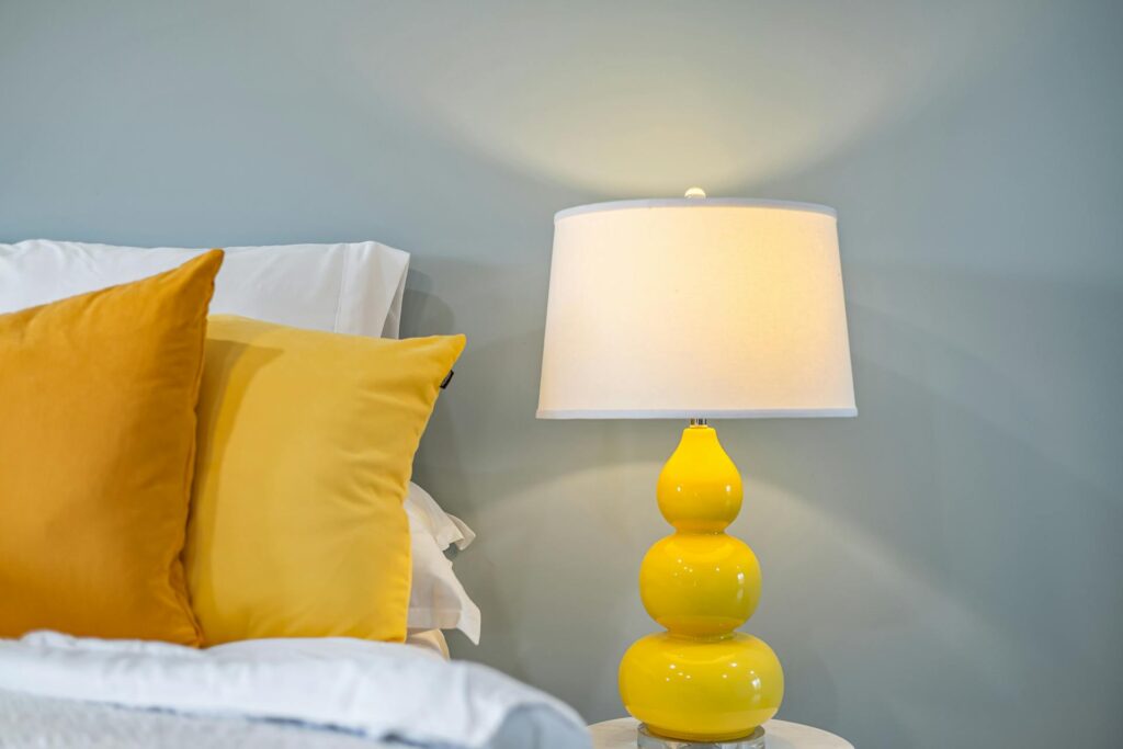 Bedside table lamp providing soft, ambient lighting for a cozy atmosphere.