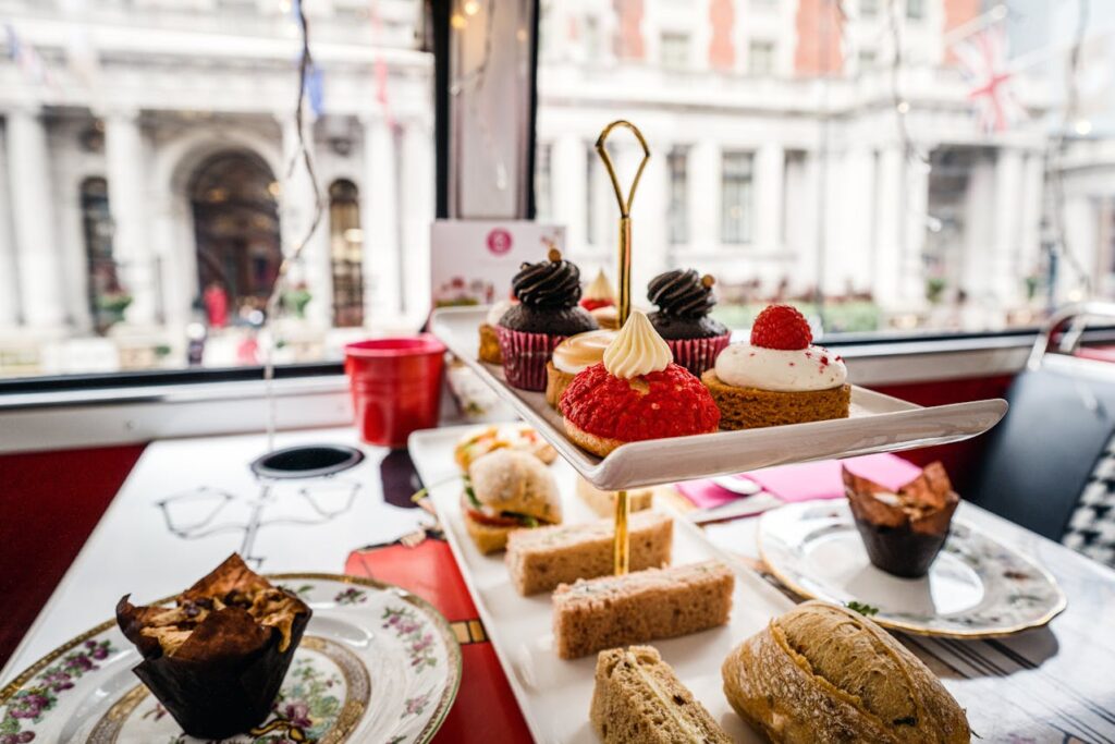 Luxurious table setup with a variety of dishes, sweets, pastries, and cakes, ready for a Valentine's Day 2025 party.