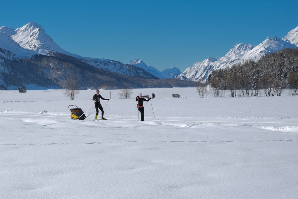 A romantic couple enjoys skiing in the Swiss Alps, Switzerland, surrounded by breathtaking snow-covered peaks, making their Valentine’s Day 2025 escape adventurous and unforgettable.