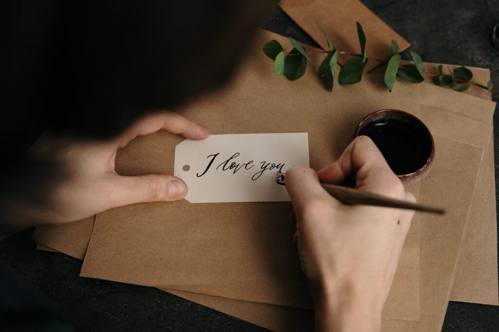 Romantic handwritten notes with a rose used in anniversary decoration at home.