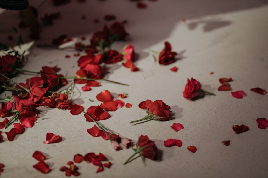 Bedroom bed decorated with rose petals for romantic anniversary decoration at home.