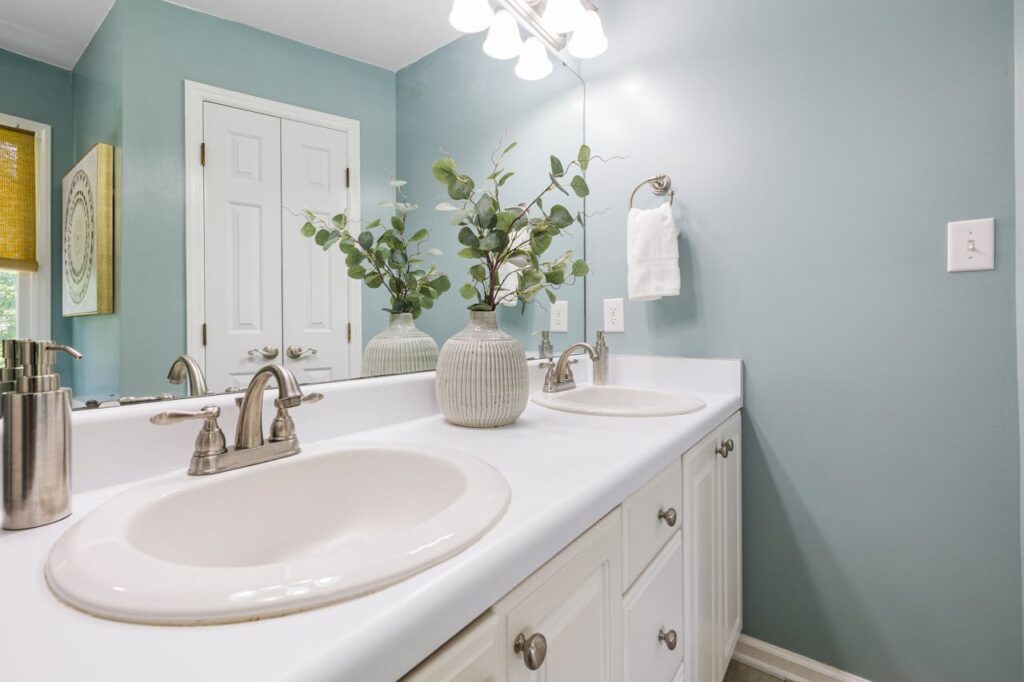 Beautiful washroom decorated with artificial plants for home decor adding a fresh and elegant look.