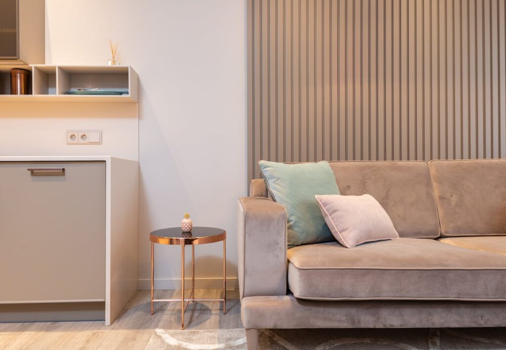 Furnished living room with couch and table, elegant interior for Airbnb arbitrage property.