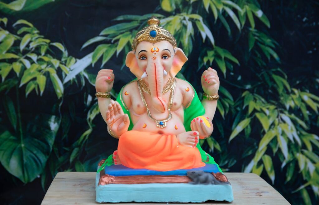 Ganesh idol with green plant and leaf decor – eco-friendly Ganapati decoration at home