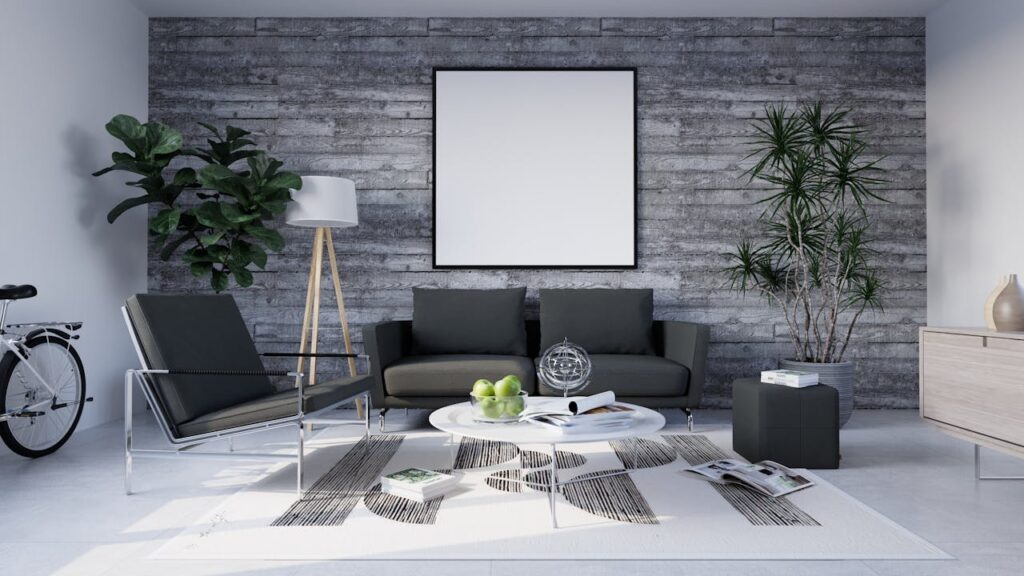 Living room with grey couch set and artificial plants for home decor creating a fresh and modern look.