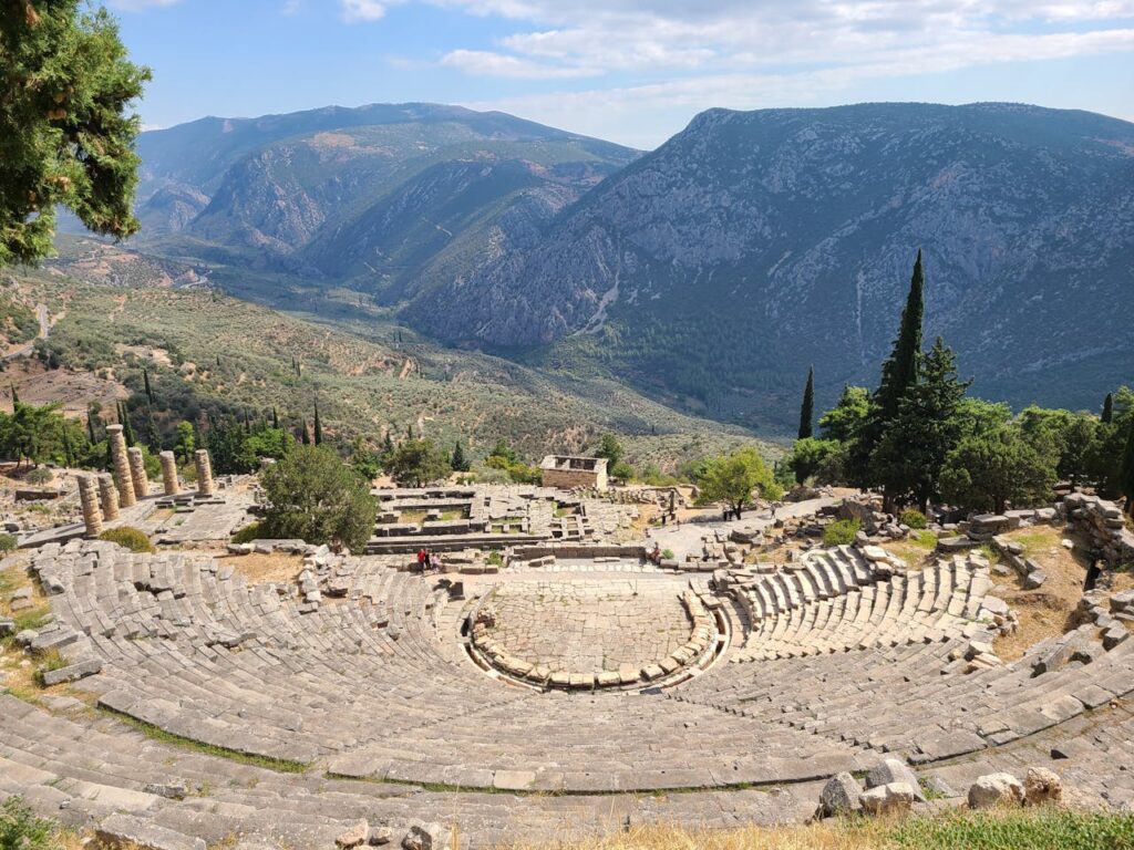 The Ancient Theater of Delphi, a historic gem on your Greece travel itinerary.