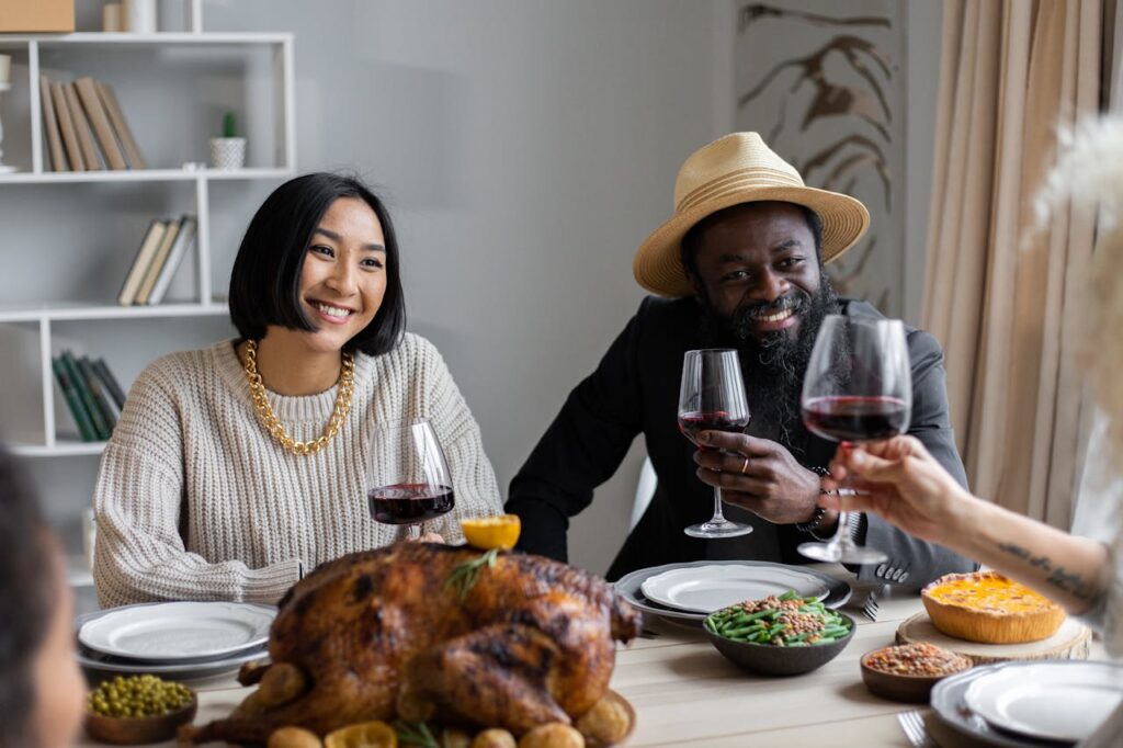 Guests smiling and enjoying food in an Airbnb living room, styled to get featured on Airbnb