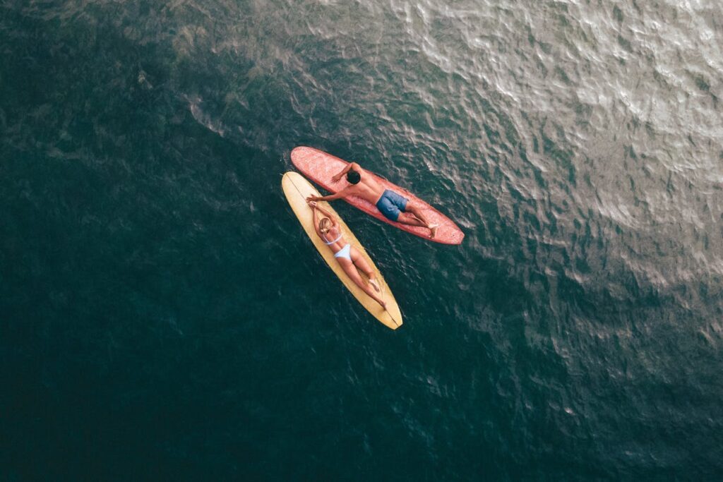 Couple spending time in a natural water body while following safe swimming practices to prevent brain eating amoeba exposure.