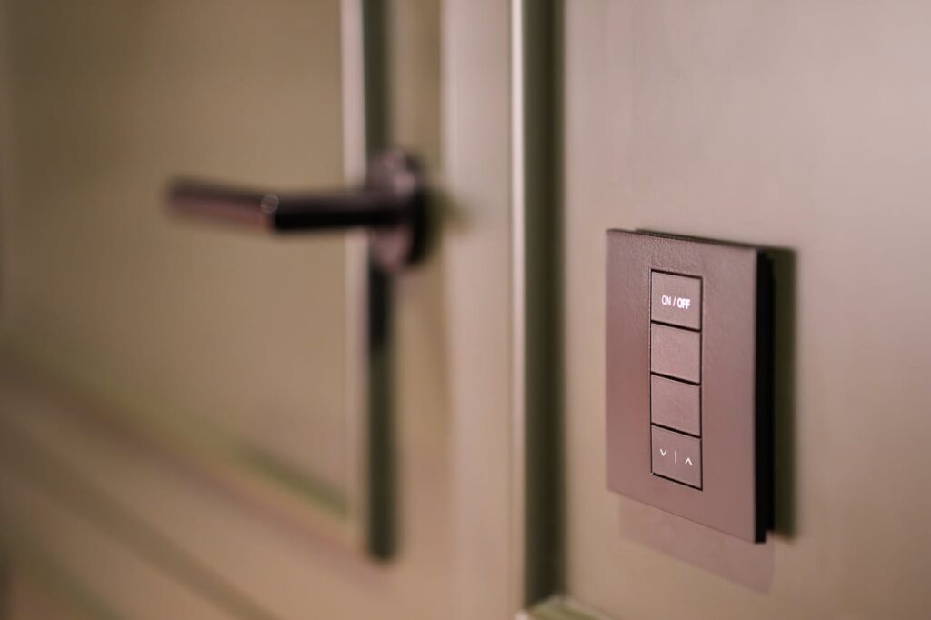 smart switch panel near the door of a modern hotel room, designed for effortless control and convenience in luxury stays