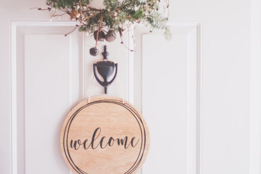 Airbnb welcome decor with floral arrangements at the main door creating inviting entrance